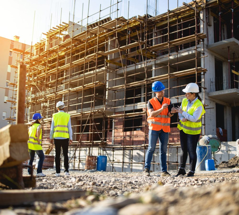 Four construction workers having meeting,stock photo